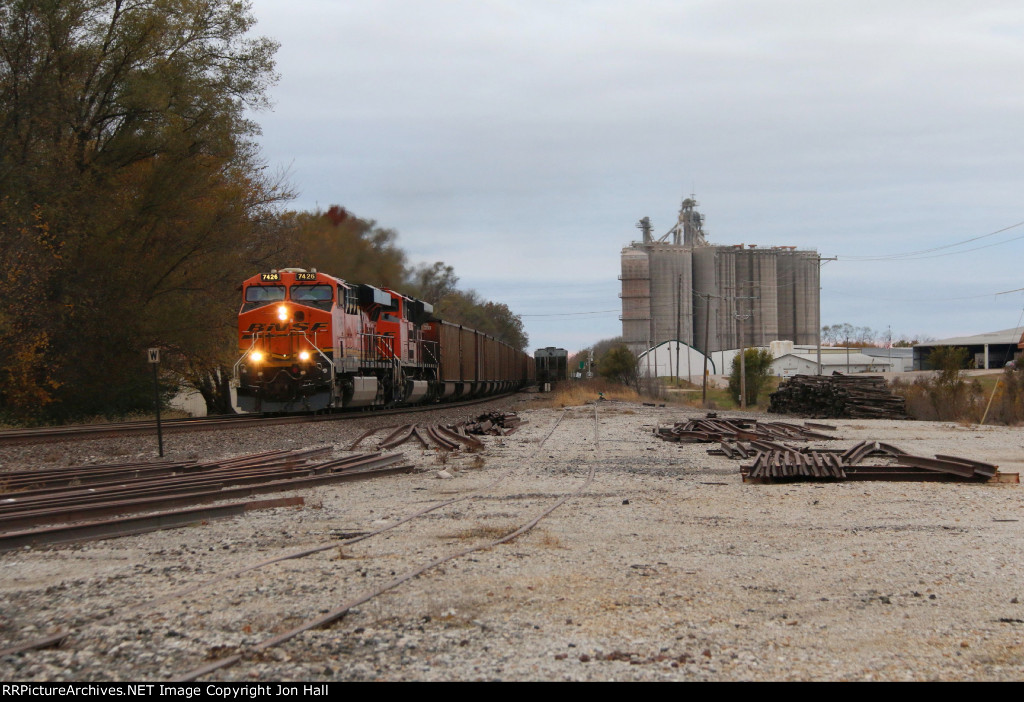 Picking up speed, 7426 leads C-NAMCNT east through town